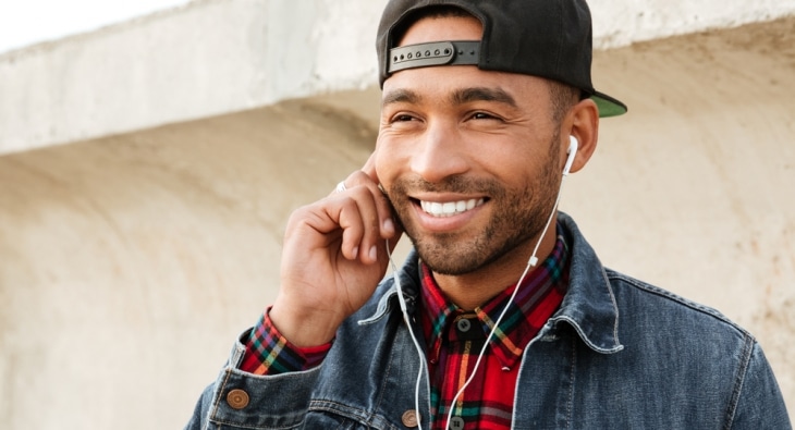 Man using headphones to listen to music