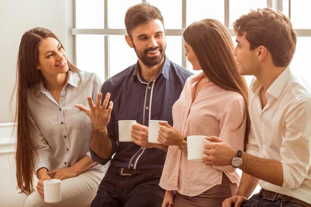 Young professionals socialising in the office