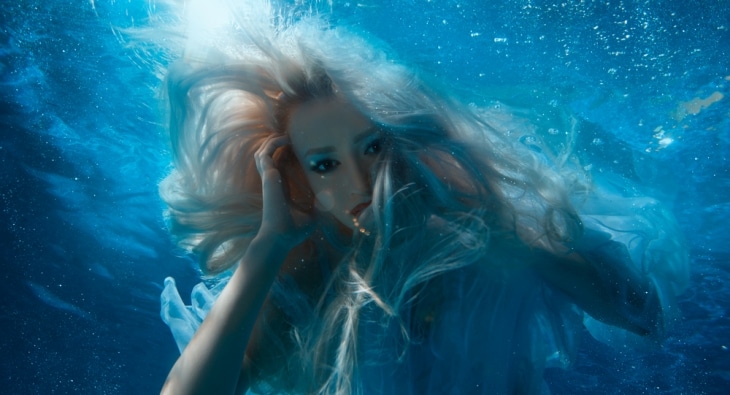 Blonde mermaid underwater