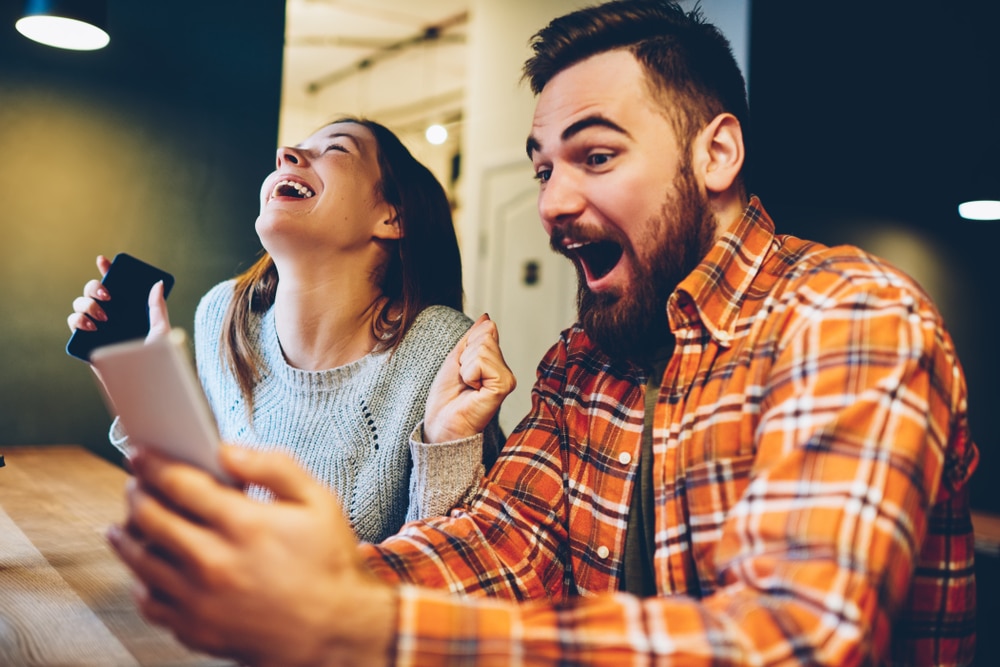 Couple celebrating betting win