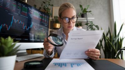 woman reading an earnings report