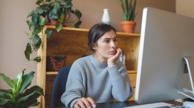 woman choosing a trading platform